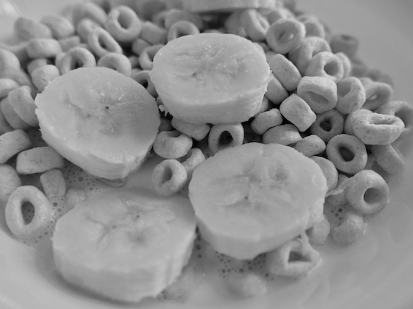 black and white picture of cereal and banana