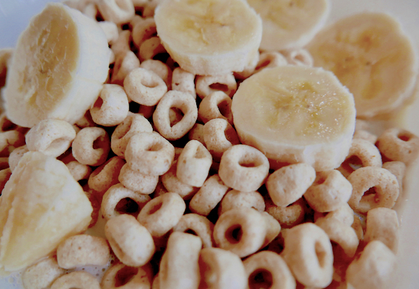 sliced banana on top of cereal