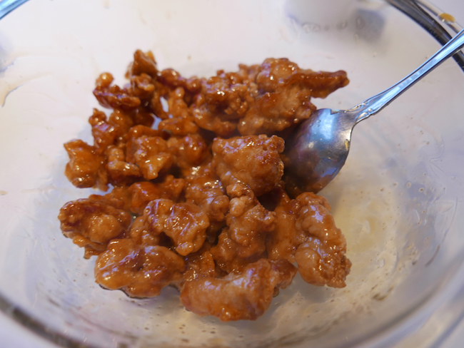 Stirring the Chinese chicken in the sweet marinade