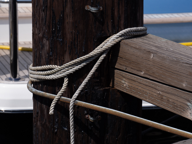 Nautical rope tied on post