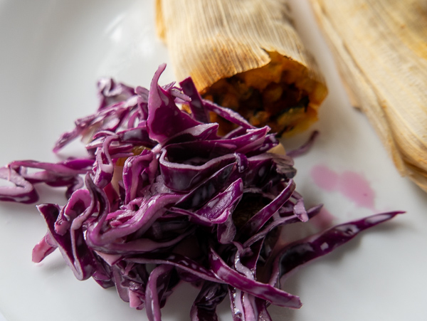 Vegetarian purple cabbage coleslaw with vegan tamales